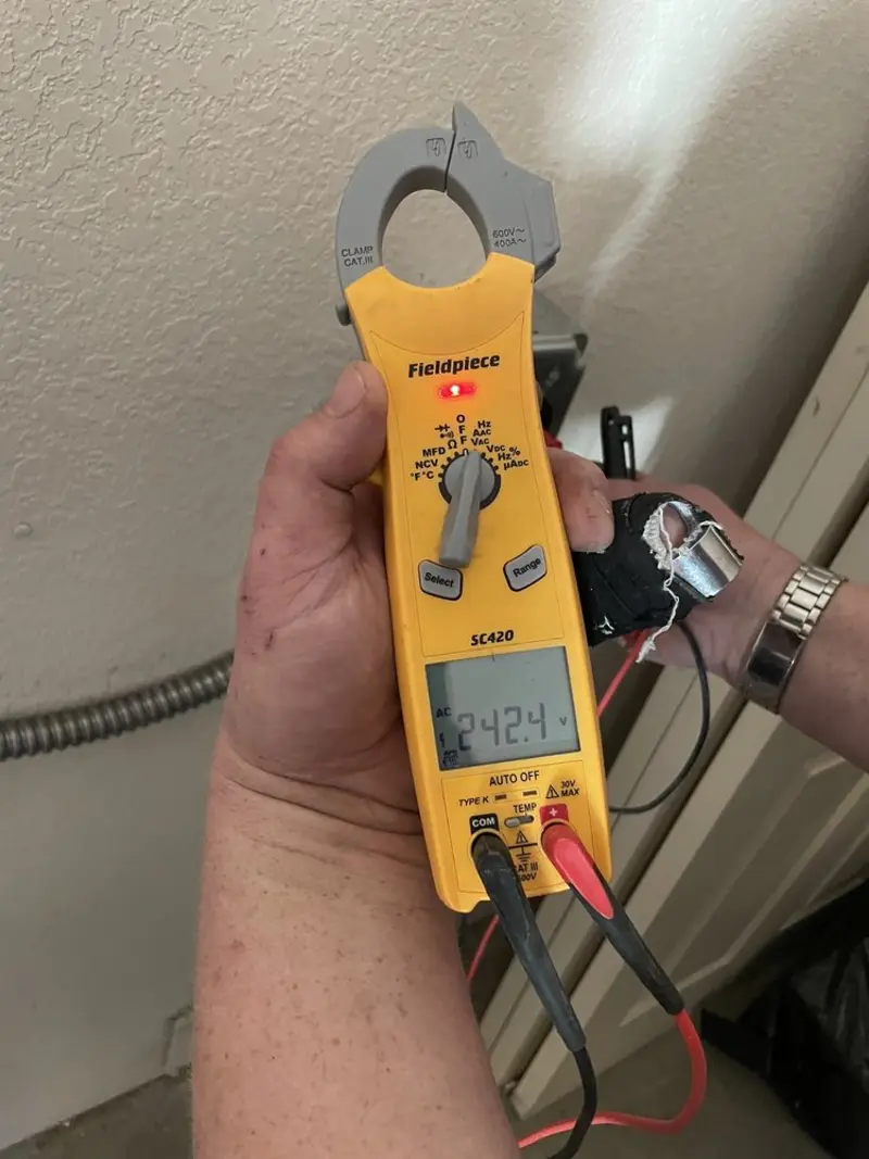 Voltage testing with clamp meter during Recessed Lighting Installation in Pascagoula